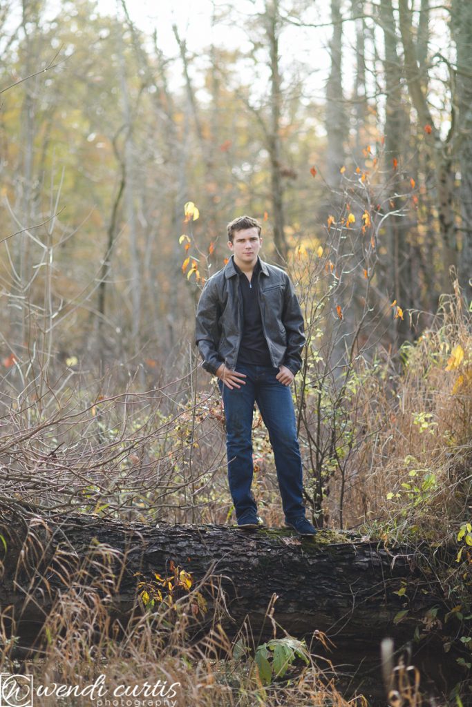 senior boy photo in woods