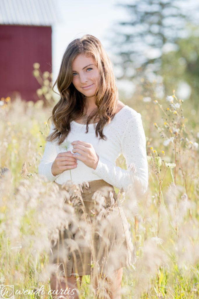 senior girl in flower field