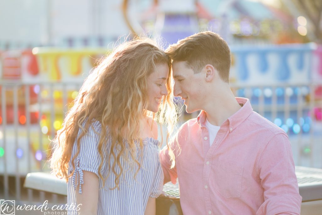 sunset engagement session at carnival